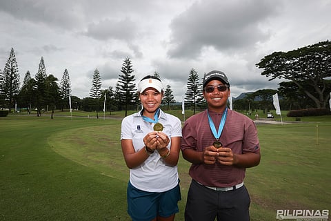 LIA Duque and Patrick Tambalque display their medals after winning the 16-18 category of the ICTSI Junior PGT Series 6 at the Mount Malarayat Golf and Country Club.
