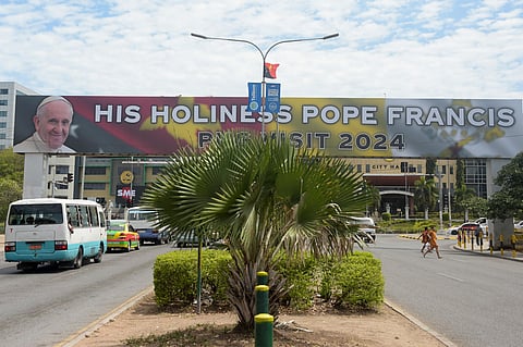 A banner diplaying a welcome message for Pope Francis is seen on a main road in Port Moresby