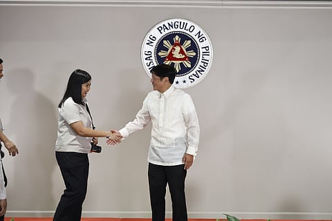 President Ferdinand Marcos Jr. congratulates newly elected PPA president, Yummie Dingding of Daily Tribune.