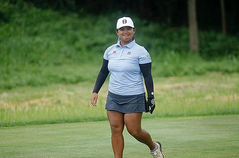 ALETHEA Gaccion smiles through difficult conditions.