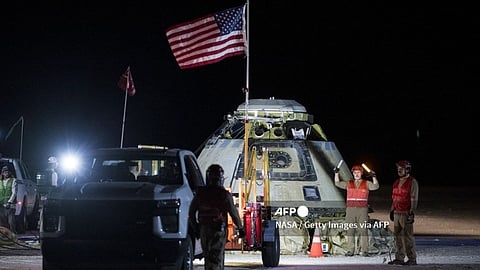 This picture courtesy of NASA taken on 6 September 2024 shows Boeing and NASA teams working around NASA's Boeing Crew Flight Test Starliner spacecraft after it landed uncrewed at White Sands, New Mexico. Boeing's beleaguered Starliner returned to Earth empty 7 September 2024 after NASA deemed it too risky to bring home the astronauts who rode the spaceship up to the International Space Station.