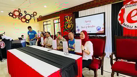 Globe and Marawi State University officials show the signed deed of donation for the P1.8 million worth of telecommunications equipment for MSU’s College of Engineering. They are (from left) James Lopez, manager for external affairs of Globe; Racquel Marcelo, Globe Territory 8 Business head; Dr. Glen Lorenzo, MSU Marawi vice president for research and extension; Atty. Basari D. Mapupuno, MSU System president; and professor Karla M. Madrid-Khalid, acting dean of the College of Engineering.