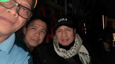 Peek-a-boo! Pastor Apollo Quiboloy (rightmost) with his lawyer Israelito Torreon (center) in the photo provided by Interior and Local Government Secretary Benhur Abalos in announcing his arrest on Sunday in Davao City. Most of the 2,000 cops ended their encampment at the Kingdom of Jesus Christ compound after his arrest.