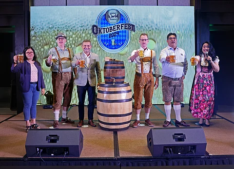 NEWPORT World Resorts chief marketing officer David Jorden (third from left) and Hilton Manila general manager John Lucas (third from right) led the ceremonial first tapping of the first keg of Oktoberfest 2024 at NWR. Also present were (from left) Distributors of Weihenstephan Brewery products managing director Larelen Go Dagondon, NWR vice president for F&B operations Knut Becker, Hilton Manila director for operations Iulai Sau and host Eiffelene Howard.