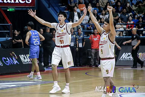 JP Boral (left) and Shawn Orgo celebrate Perpetual Help’s 69-67 victory over Arellano on Friday in Season 100 of the NCAA basketball tournament.