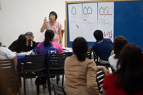 SINGAPOREAN former Math professor Ng Swee Fong demonstrates Singapore Math concepts to local teachers at the Sacred Heart School-Ateneo de Cebu. The Singapore Math training on 15 to 19 July was organized by the Security Bank Foundation Inc.