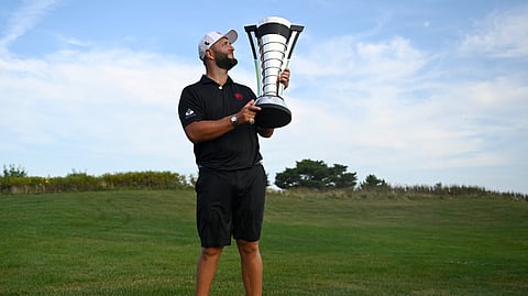 JON Rahm lifts the trophy after winning LIV Golf: Chicago at the Bolingbrook Golf Club.