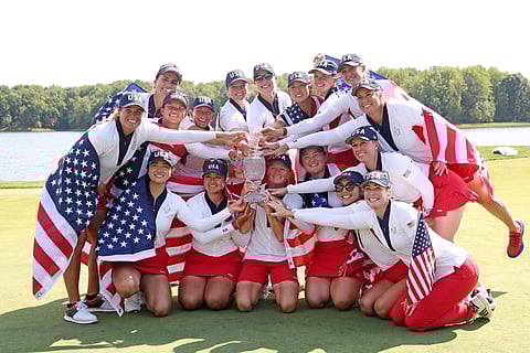 MEMBERS of the United States celebrate after beating Europe, 15.5-12.5, to rule the Solheim Cup for the first time in seven years.