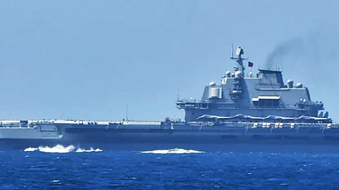 A handout photo released by Japan's Ministry of Defence Joint Staff Office shows the Chinese aircraft carrier Liaoning at sea in waters near Japan's southern Okinawa region