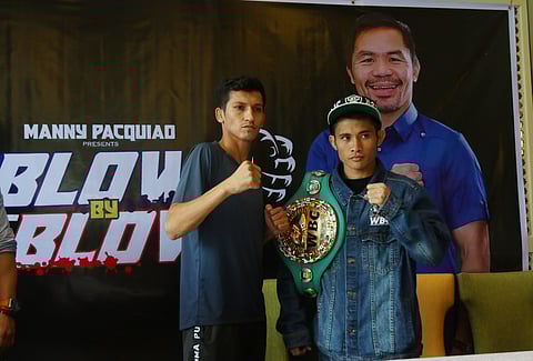 MELVIN Jerusalem (right) and Luis Castillo declare their readiness to rumble for the WBC minimumweight title on Sunday at the Mandaluyong City College Gym.