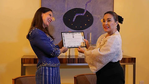 Senator Loren Legarda receives the Certificate of Conferment of Officier dans l’Ordre National de la Légion d'Honneur from French Ambassador Marie Fontanel.