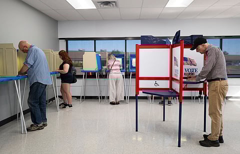 VOTERS fill out their ballots at the Minneapolis Elections & Voter Services building on 20 September 2024 in Minneapolis, Minnesota.