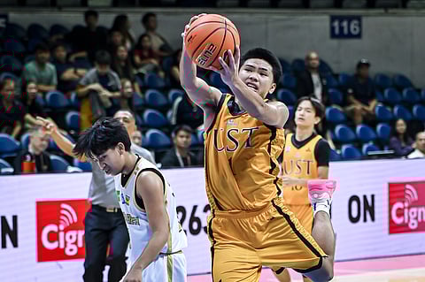 ANDWELE Cabañero of UST pulls down the rebound during their Season 87 UAAP Junior High School basketball tournament match against NUNS. The Tiger Cubs prevailed, 84-83.