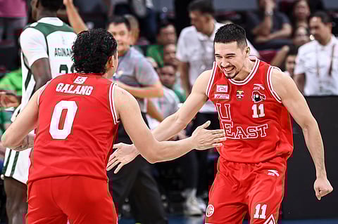 UE's John Abate whoops it up with teammate Ethan Galang after upsetting La Salle, 75-71, in the UAAP Season 87 men's basketball tournament.