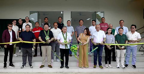 PAGCOR VP for corporate social responsibility group Ramon Stephen Villaflor (fourth from left) and Dasmariñas City Mayor Jennifer Barzaga (fifth from left) lead the ribbon-cutting ceremony during the inauguration of the PAGCOR-funded socio-civic center in Barangay Langkaan II, Dasmariñas City.