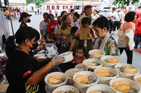 HUNDREDS of people receive food packs during the birthday treat of President Ferdinand R. Marcos Jr. at Malacañan Palace on 13 September 2024.