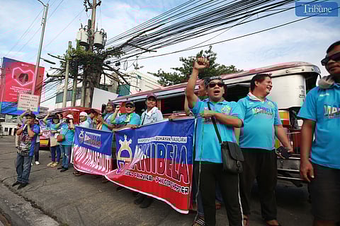 (September 23 2024)…………Manibela members are encouraging others to join their protest rally against the franchise consolidation requirement under the Public Utility Vehicle Modernization Program on Commonwealth Avenue in Quezon City on Monday, September 23, 2024..………Photo/Analy Labor