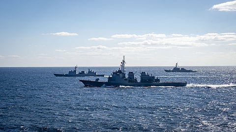 (FILES) This undated handout photo taken by the US Navy and released on 18 January 2024 by the Joint Staff Office of the Defense Ministry of Japan shows the Japan Maritime Self-Defense Force destroyer JDS Kongo (C) taking part in three-day trilateral military maritime exercises with the navies of the US and South Korea, at an undisclosed location in the Pacific Ocean.
