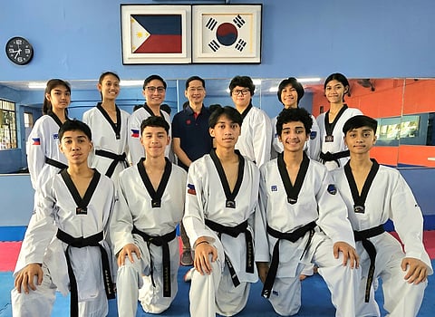 THE rising stars of Philippine taekwondo (back row, from left) pose before their training session at the PTA headquarters at the Rizal Memorial Sports Complex. They are (back row, from left) Rhiyanne Agatha Shay Cadileña, Tachiana Keizha Mangin, coach Paul Romero, delegation head Raul Samson, coach Elaine Alora, Felicity Jana Castel, Quynh Louise Edillor (Female -42kg). In the front row are Felix Ace Perez, Ethan Jervey Chavez, John Angelo Pascual, Mythaious Angelous Francois Lustado and Michael Cabaluna.