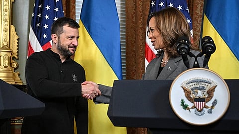 US Vice President and Democratic presidential candidate Kamala Harris (right) and Ukraine’s President Volodymyr Zelensky shake hands after speaking to the press before a private meeting, in the Vice President’s ceremonial office in the Eisenhower Executive Office Building on the White House campus on September 26, 2024 in Washington, DC.