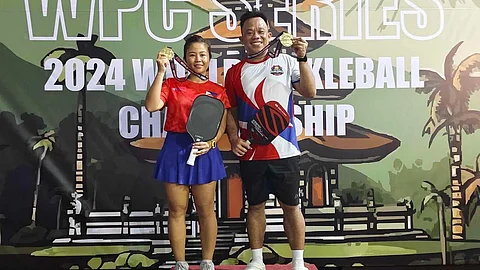 BIEN Zoleta and Johner Ombrezo celebrate after winning the gold medal in the doubles 35+ Open Category event of the World Pickleball Championships.
