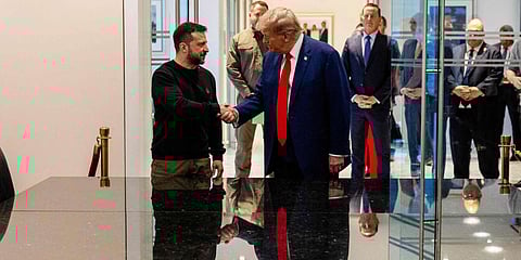 Ukrainian President Volodymyr Zelensky and Republican presidential nominee, former US President Donald Trump, shake hands during a meeting, in New York City, on September 27, 2024.