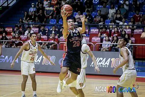 Deo Cuajao drives his way to a team-high 19 points to power Letran to an 82-73 triple overtime victory over Perpetual on Saturday in their Season 100 NCAA basketball game.