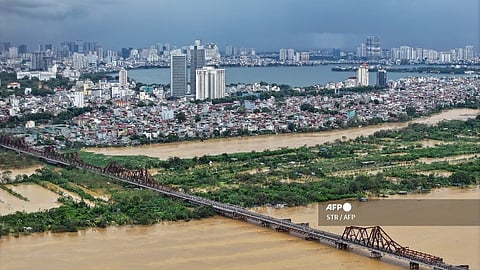 This aerial photo shows the flooded Red River in Hanoi on 10 September 2024, in the aftermath of Typhoon Yagi hitting northern Vietnam. Vietnam suffered $3.3 billion in economic losses as a result of deadly Typhoon Yagi, which swept across the country's north earlier this month causing hundreds of fatalities, state media said on 28 September, citing government officials.