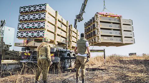 Military personnel operating the Iron Dome