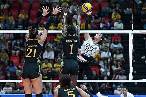 Angge Poyos strikes for UST which slammed FEU, 25-22, 25-18, 25-14, on Sunday to win Game One of their best-of-three series.
