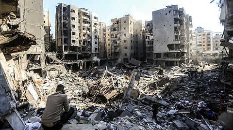 People check the rubble of buildings which were levelled on 27 September by Israeli strikes that targeted and killed Hezbollah leader Hassan Nasrallah in the Haret Hreik neighbourhood of Beirut's southern suburbs, on 29 September 2024.
