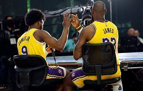 Lebron James (right) is thrilled to team up with his son, Bronny, for the Los Angeles Lakers in the 2024-2025 season of the NBA.