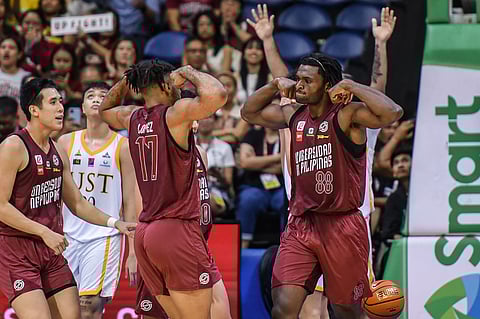 Dikachi Ududo celebrates following the UP Fighting Maroons’ emphatic 81-70 win over the UST Growling Tigers in the UAAP Season 87 men’s basketball tournament yesterday at the Smart Araneta Coliseum.