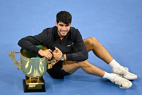 Carlos Alcaraz celebrates after booking a 6-7 (6/8), 6-4, 7-6 (7/3) win over Jannik Sinner to rule the China Open in Beijing.