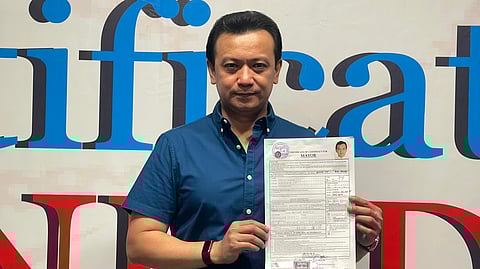 Former Senator Antonio "Sonny" Trillanes shows his CoC for the mayoral post of Caloocan.