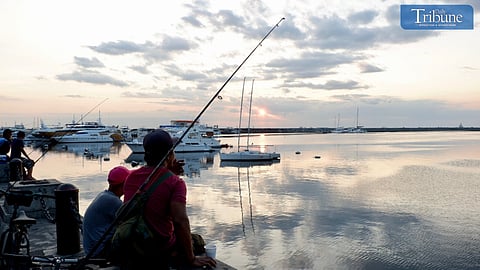 Boats and fishing by Manila Bay