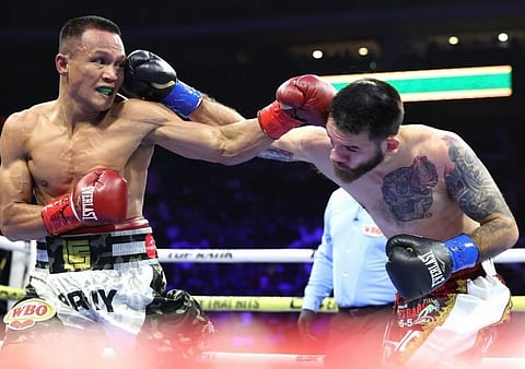 Charly Suarez (left), who knocked out American Jorge Castaneda in his last fight in Arizina, will have to wait a while before getting a shot at the WBO super-featherweight crown, according to Top Rank.