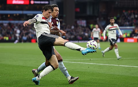 LOOK: Manchester United's Swedish defender #02 Victor Lindelof (L) crosses the ball during the English Premier League football match between Aston Villa and Manchester United at Villa Park in Birmingham, central England on 6 October 2024. | Photo courtesy of Adrian Dennis / AFP