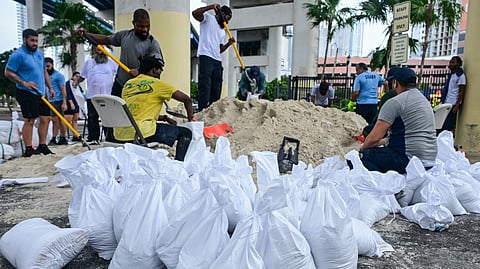 Volunteers from the city of Miami fill sandbags to help residents prepare for the arrival of Hurricane Milton in Miami, Florida on 7 October 2024. Florida's governor has declared a state of emergency on Saturday as forecasters warned that Hurricane Milton is expected to make landfall later this week.