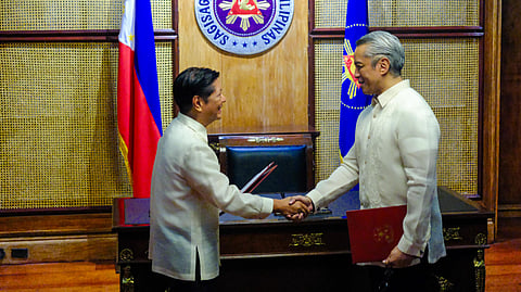 A new era President Ferdinand Romualdez Marcos Jr. shakes hands with Jonvic Remulla after administering his oath of office as the new Secretary of the Interior and Local Government on Tuesday, marking a pivotal moment in leadership and governance.