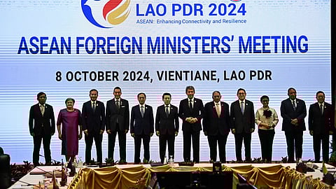 Myanmar Permanent secretary of foreign affairs Aung Kyaw Moe, on the far left, poses with the foreign ministers of ASEAN during the bloc’s Foreign Ministers Plenary Meeting session in Vientiane on October 8.