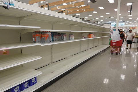 Empty shelves are seen in the drinks aisle of a store as people prepare before Hurricane ‘Milton’s’ arrival in Fort Myers, Florida.