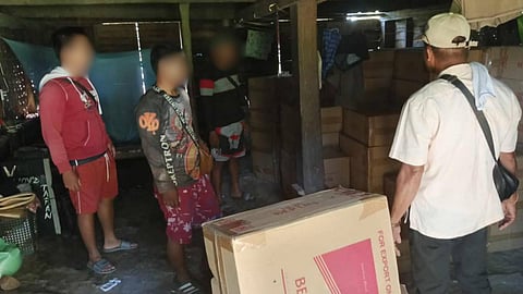 Law enforcement officers in Palawan conduct an inventory of the smuggled cigarettes in a warehouse in Brooke's Point town, southern Palawan.