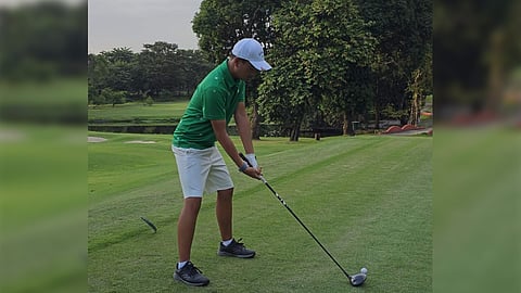 Geoffrey Tan preparing to stripe Wack Wack West Course’s No. 4.