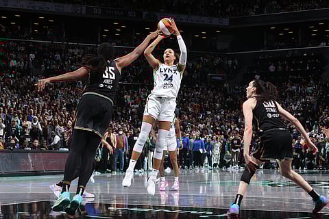 Napheesa Collier shoots the game-winning basket that lifted the Minnesota Lynx to a 95-93 come-from-behind victory over the New York Liberty in Game 1 of their WNBA best-of-seven finals series.