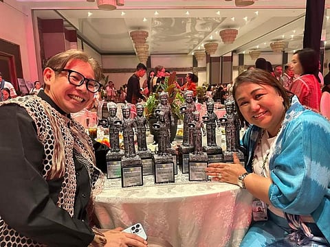 Baguio Tourism Council Chairperson Gladys Vergara and City Tourism Officer Alec Mapalo proudly display the 10 trophies Baguio City received at the 2024 Association of Tourism of the Philippines (ATOP) Awards.