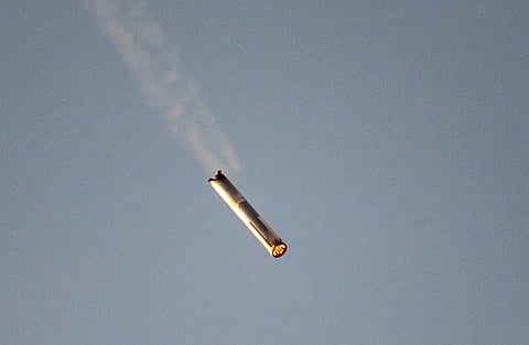 Starship's Super Heavy Booster comes in for a "landing" at the launch pad in Starbase near Boca Chica, Texas, on October 13, 2024, during the Starship Flight 5 test. SpaceX successfully "caught" the first-stage booster of its Starship megarocket Sunday as it returned to the launch pad after a test flight, a world first in the company's quest for rapid reusability.