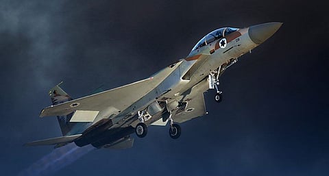 An Israeli F-15 E fighter jet takes off during an air show as part of the graduation ceremony of Israeli pilots at the Hatzerim air force base in the southern Negev desert, near the city of Beersheva, on June 25, 2015.