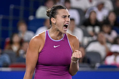 Aryna Sabalenka rejoices after scoring against Coco Gauff in their Wuhan Open semifinal match Saturday. Sabalenka won, 1-6, 6-4, 6-4.