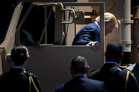 US President Donald Trump gets out of a THAAD missile truck during the 3rd Annual Made in America Product Showcase on the South Lawn at the White House in Washington, DC, on July 15, 2019.